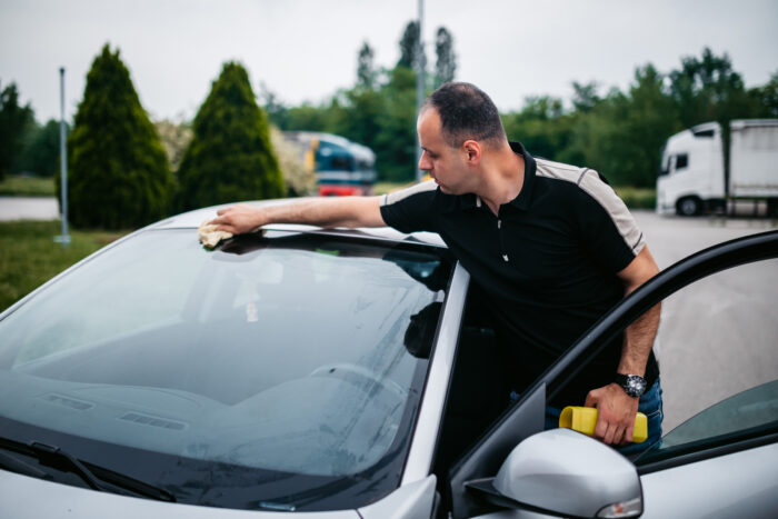 man repair windshield in Langley